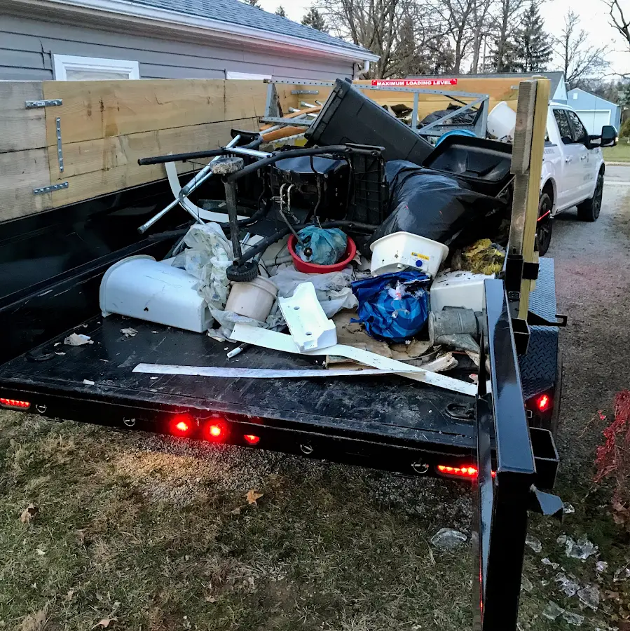 Roll-off dumpster delivered to a residential driveway in Hollis