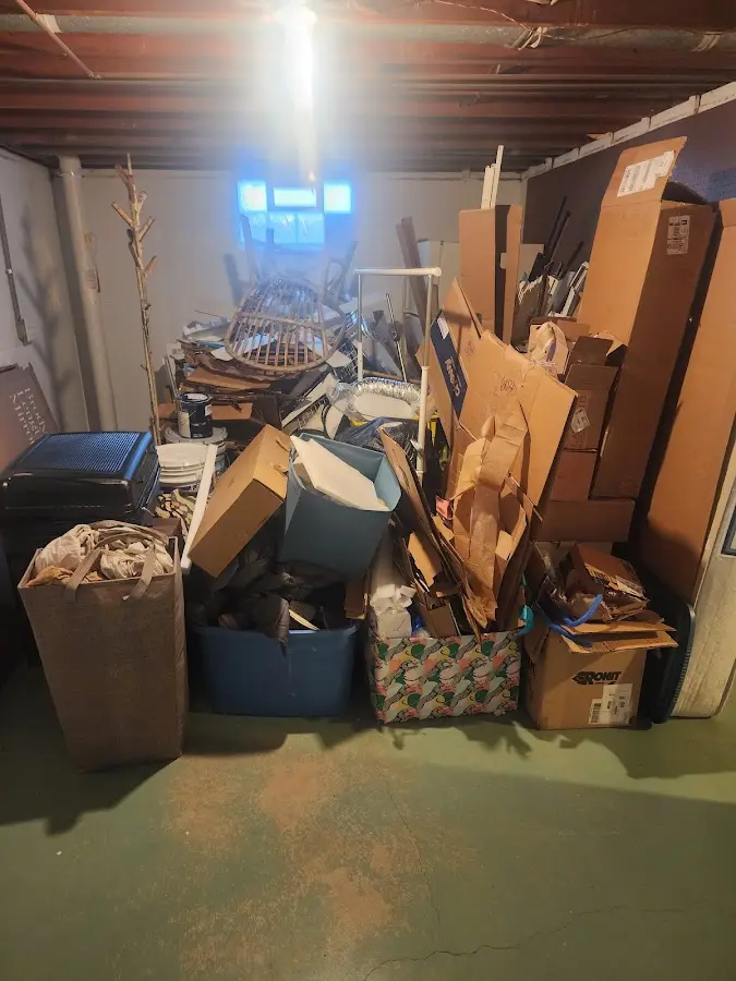 Roll-off dumpster container at job site for 6 Yard Dumpster Rental in Hollis